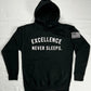 Excellence Never Sleeps   Printed graphic on front. Printed graphic on back.  Embroidered Patch Sewn on Left Sleeve.   8.5 oz Soft-Washed Comfort Weight Fleece  Facing yarn (outside print surface) is 100% Cotton  65% Ringspun Cotton 35% Polyester.  Sizes: S-M-L-XL-2XL  Color: Black